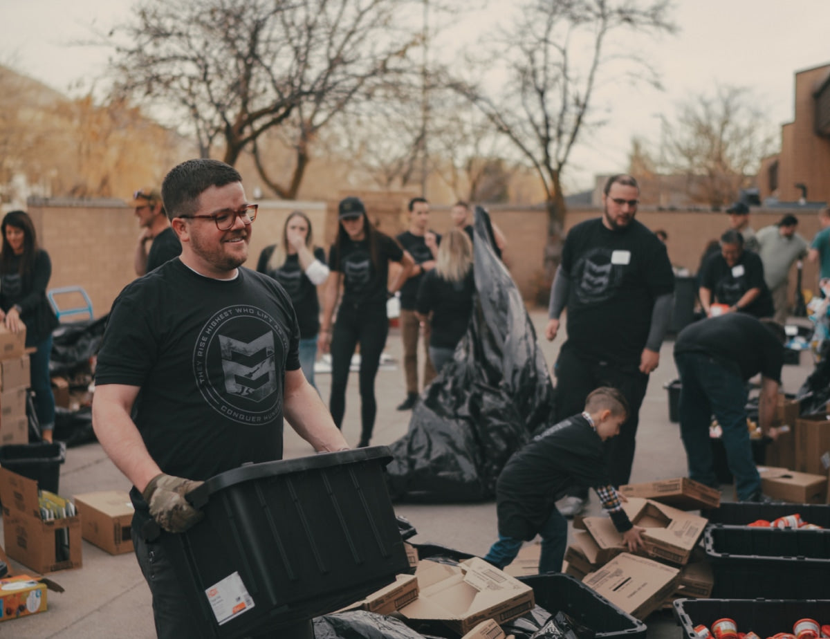 Conquer Hunger Operation. Group of people gathering food