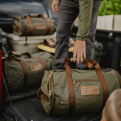 MTN OPS Canvas Duffle Bags in truck bed